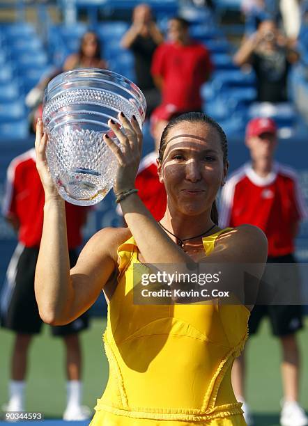 Jelena Jankovic of Serbia poses with the trophy after defeating Dinara Safina of Russia in the finals of the Western & Southern Financial Group...