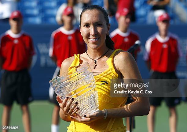 Jelena Jankovic of Serbia poses with the trophy after defeating Dinara Safina of Russia in the finals of the Western & Southern Financial Group...
