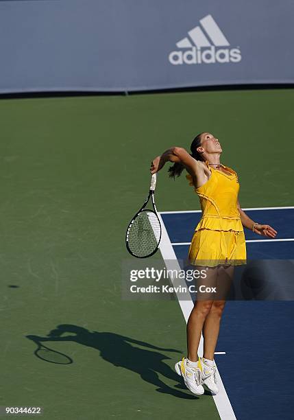 Jelena Jankovic of Serbia serves to Dinara Safina of Russia in the finals of the Western & Southern Financial Group Women's Open on August 16, 2009...