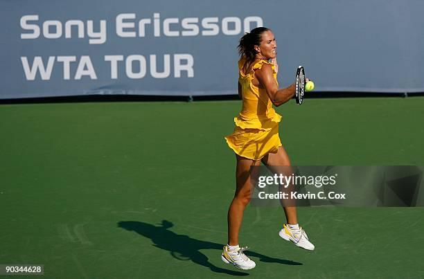 Jelena Jankovic of Serbia returns a shot to Dinara Safina of Russia in the finals of the Western & Southern Financial Group Women's Open on August...