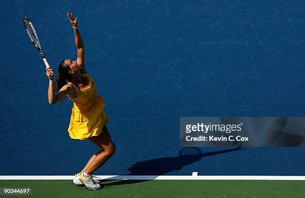 Jelena Jankovic of Serbia serves to Dinara Safina of Russia in the finals of the Western & Southern Financial Group Women's Open on August 16, 2009...
