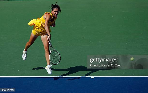 Jelena Jankovic of Serbia returns a shot to Dinara Safina of Russia in the finals of the Western & Southern Financial Group Women's Open on August...