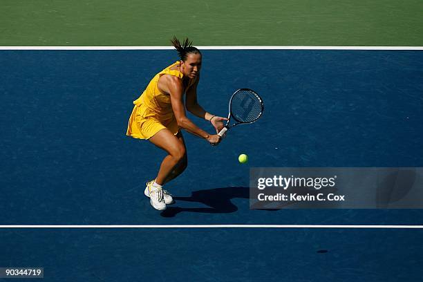 Jelena Jankovic of Serbia returns a shot to Dinara Safina of Russia in the finals of the Western & Southern Financial Group Women's Open on August...