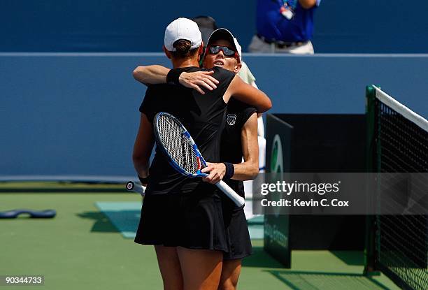 Cara Black of Zimbabwe celebrates with partner Liezel Huber after defeating Nuria Llagostera Vives and Maria Jose Martinez Sanchez, both of Spain, in...