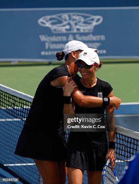 Cara Black of Zimbabwe celebrates with partner Liezel Huber after defeating Nuria Llagostera Vives and Maria Jose Martinez Sanchez, both of Spain, in...