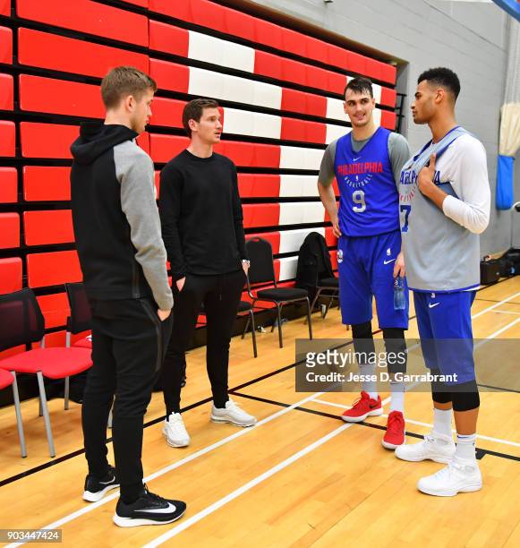 Dario Saric and Timothe Luwawu-Cabarrot of the Philadelphia 76ers speak with members of the tottenham football club during practice as part of the...