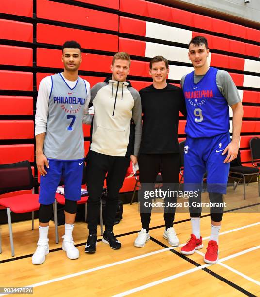 Dario Saric and Timothe Luwawu-Cabarrot of the Philadelphia 76ers speak with members of the tottenham football club during practice as part of the...