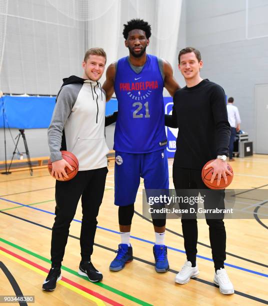 Joel Embiid of the Philadelphia 76ers poses with members of the tottenham football club during practice as part of the 2018 NBA London Global Game at...