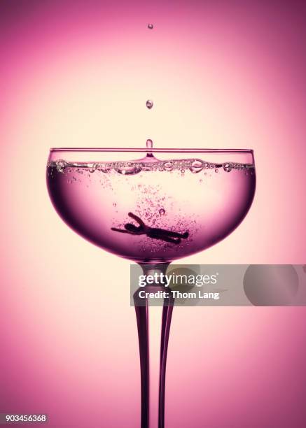 drowned champagne swimmer close up - martini glass stock pictures, royalty-free photos & images