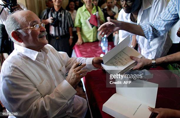The president of the UN General Assembly, Nicaraguan Miguel D'Escoto autographs his book "Anti-Imperialism and Nonviolence" in Havana, on September...