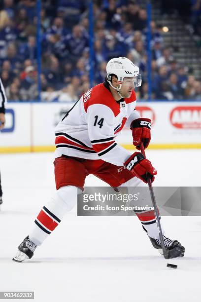 Carolina Hurricanes right wing Justin Williams skates with the puck in the third period of the NHL game between the Carolina Hurricanes and Tampa Bay...