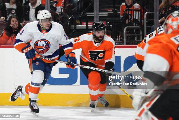 Shane Prince of the New York Islanders skates against Radko Gudas of the Philadelphia Flyers on January 4, 2018 at the Wells Fargo Center in...