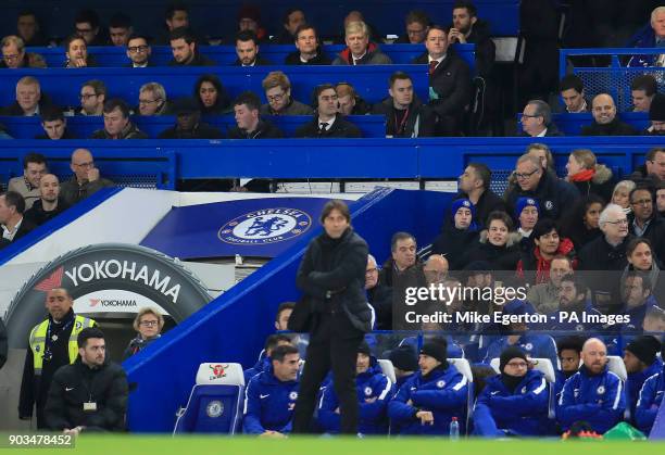 Arsenal manager Arsene Wenger sits in the press box behind Chelsea manager Antonio Conte during the Carabao Cup Semi Final, First Leg match at...