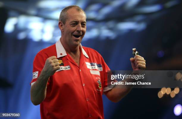 Wayne Warren of Wales celebrates victory during Day Four of the BDO World Darts Championship at Lakeside Shopping Centre on January 10, 2018 in...