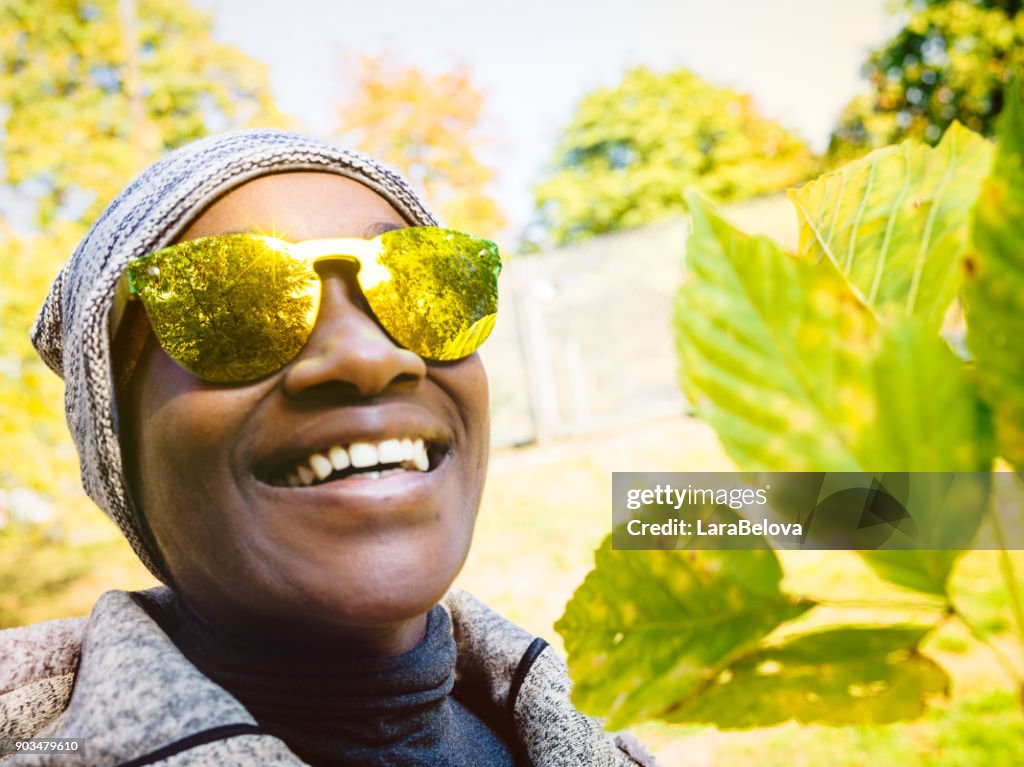 Portrait of young African woman in park