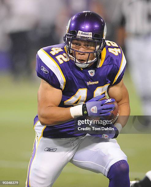 Ian Johnson of the Minnesota Vikings carries the ball during an NFL preseason game against the Dallas Cowboys at the Hubert H. Humphrey Metrodome,...