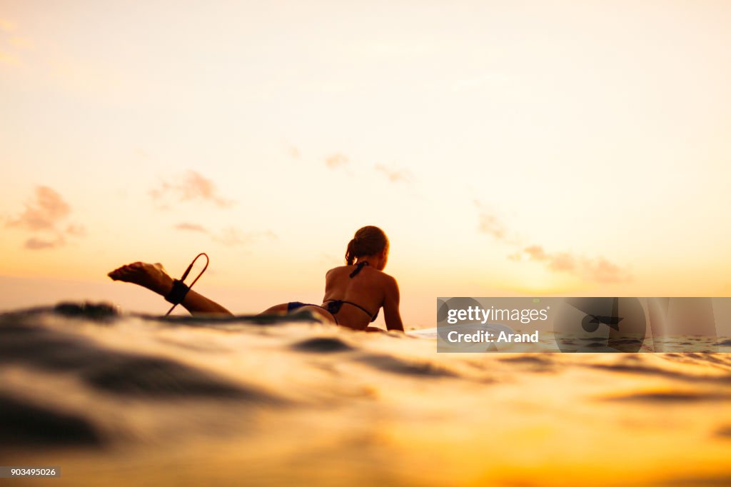 Young surfer woman