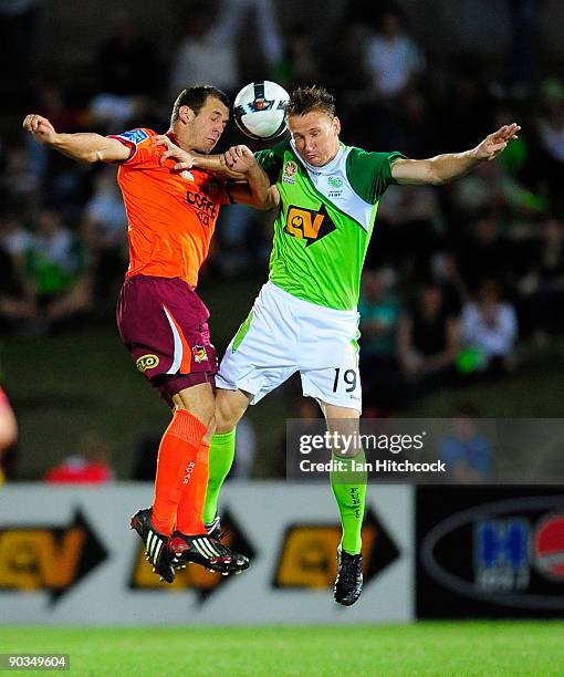 Daniel McBreen of the Fury contests the ball with Luke Devere of the Roar during the round five A-League match between the North Queensland Fury and...