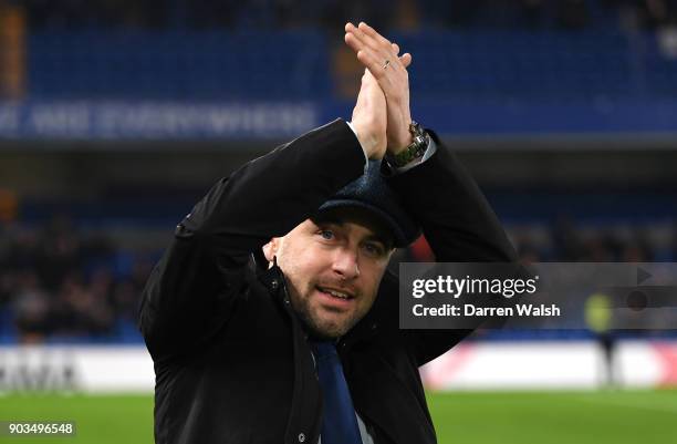 Joe Cole waves to the fans at half time during the Carabao Cup Semi-Final First Leg match between Chelsea and Arsenal at Stamford Bridge on January...