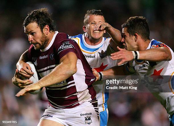 Josh Perry of the Sea Eagles busts through the defence during the round 26 NRL match between the Manly Warringah Sea Eagles and the Gold Coast Titans...
