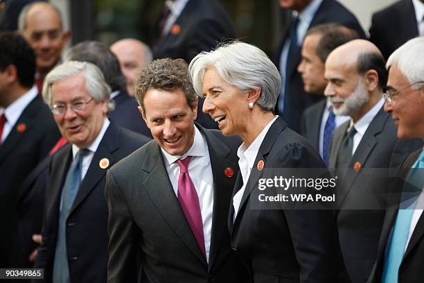 Treasury Secretary Tim Geithner talks to French finance minister Christine Lagarde following a group picture at the G20 finance Minister's summit, at...