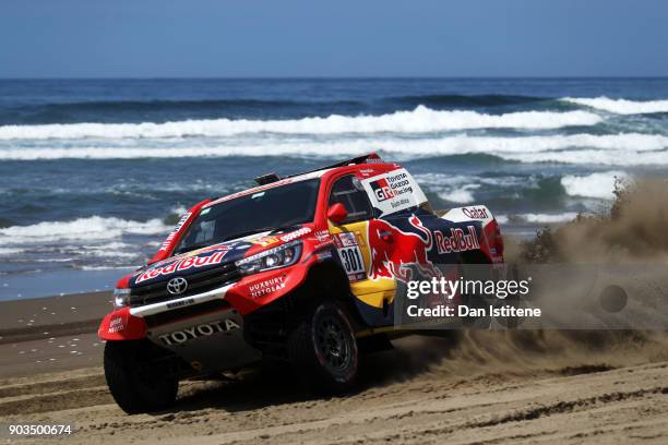 Nasser Al-Attiyah of Qatar and Toyota Gazoo Racing drives with co-driver Matthieu Baumel of France in the Hilux Toyota car in the Classe : T1.1 : 4x4...