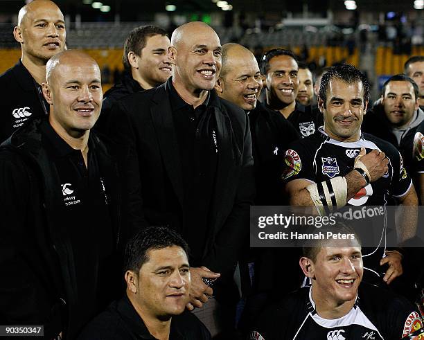Former Warriors Monty Betham and Awen Guttenbeil join Stacey Jones for a team photo after the round 26 NRL match between the Warriors and the...
