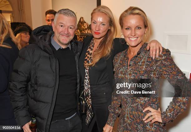 Dominic Thrupp, guest and Davinia Taylor attend the private view of "JR: Giants - Body of Work" at Lazinc on January 10, 2018 in London, England.
