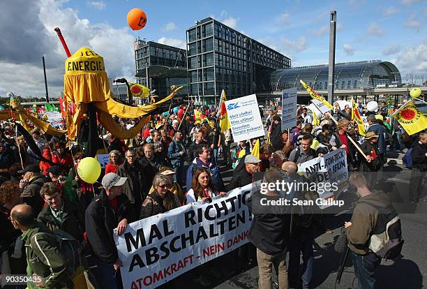 Anti-nuclear protesters standing in front of Hauptbahnhof railway station prepare to march during an anti-nuclear energy demonstration on September...