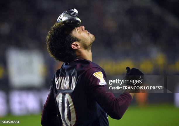 Paris Saint-Germain's Brazilian forward Neymar celebrates after scoring a penalty kick during the French League Cup quarter-final football match...