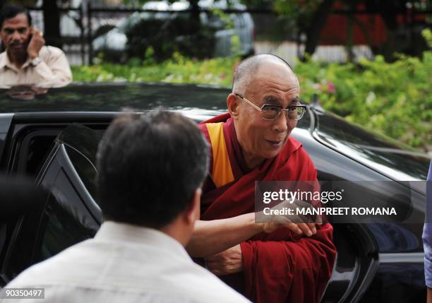 Exiled Tibetan spiritual leader the Dalai Lama arrives at Institute of Management Studies to attend a conference in Noida, a suburb of New Delhi, on...