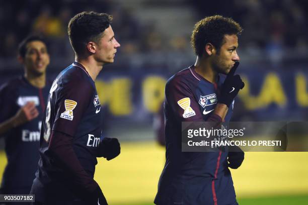 Paris Saint-Germain's Brazilian forward Neymar celebrates after scoring a penalty kick during the French League Cup quarter-final football match...