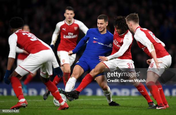 Eden Hazard of Chelsea is closed down by Mohamed Elneny of Arsenal during the Carabao Cup Semi-Final First Leg match between Chelsea and Arsenal at...