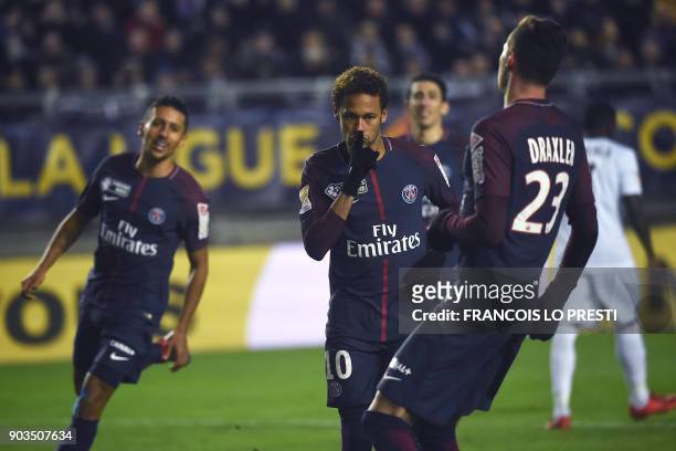 Paris Saint-Germain's Brazilian forward Neymar celebrates after scoring a penalty kick during the French League Cup quarter-final football match...