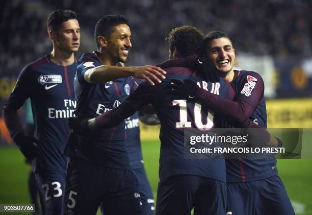 Paris Saint-Germain's Brazilian forward Neymar celebrates with teammates after scoring a penalty kick during the French League Cup quarter-final...