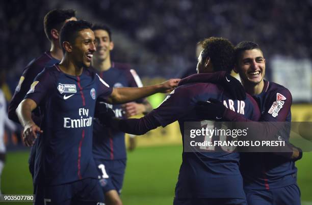 Paris Saint-Germain's Brazilian forward Neymar celebrates with teammates after scoring a penalty kick during the French League Cup quarter-final...