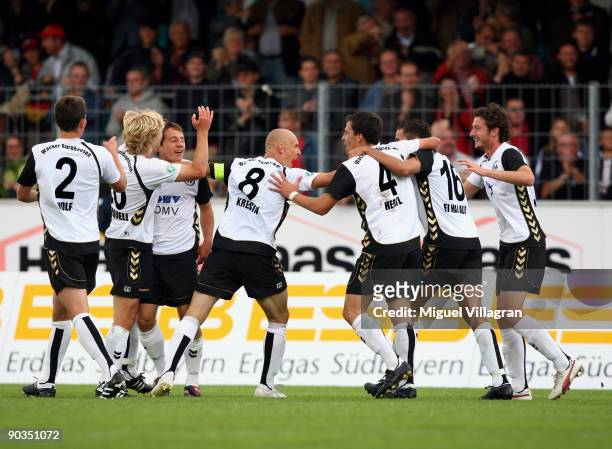Players of Burghausen celebrate their team's third goal during the 3. Liga match between Wacker Burghausen and SpVgg Unterhaching on September 5,...