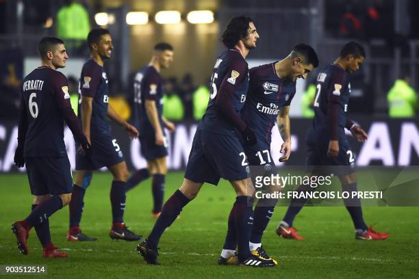 Paris Saint-Germain's French midfielder Adrien Rabiot celebrates with teammates after scoring a goal during the French League Cup quarter-final...