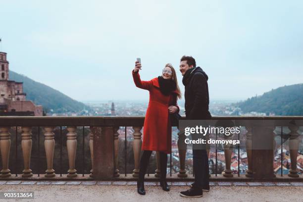 young people exploring heidelberg on a lovely winter day - heidelberg germany stock pictures, royalty-free photos & images