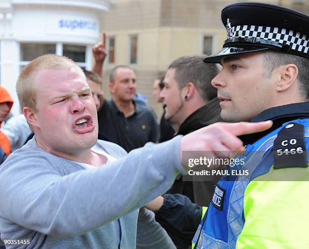 Protestors from the English Defence League take part in a dmonstration against Islamic extremism in Birmingham, central England, on September 5,...