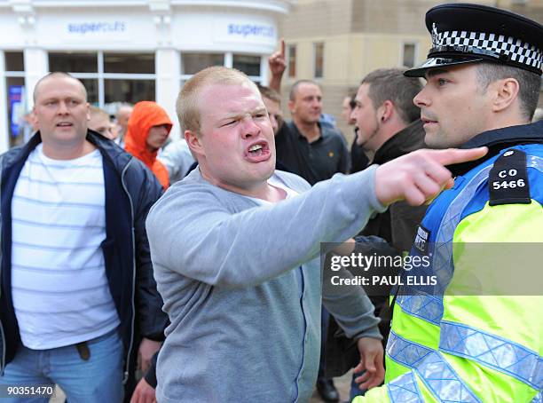 Protestors from the English Defence League take part in a dmonstration against Islamic extremism in Birmingham, central England, on September 5,...