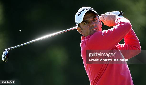 Paul McGinley of Ireland watches his tee-shot on the 16th hole during the third round of The Omega European Masters at Crans-Sur-Sierre Golf Club on...