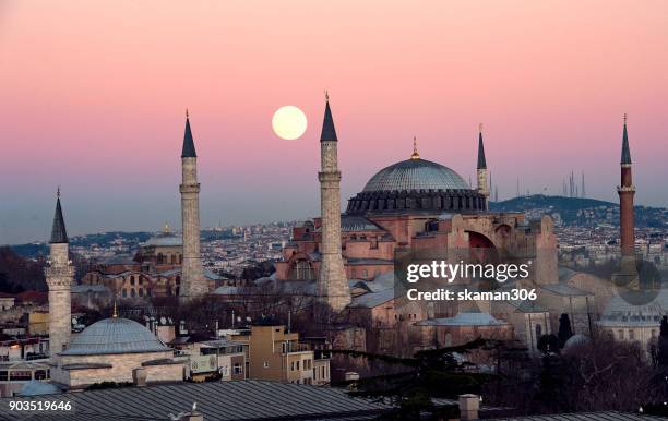 the suoer moon rise over hagia sophia chruch near blue mosque in istanbul - hagia sophia stock-fotos und bilder