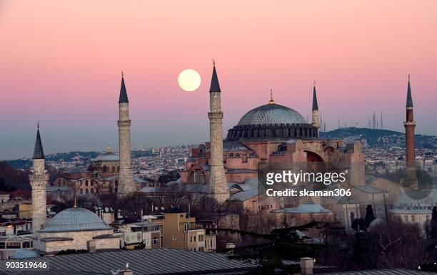 the suoer moon rise over hagia sophia chruch near blue mosque in istanbul - istanbul sunset stock pictures, royalty-free photos & images