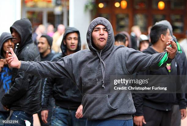 Anti-right wing youths taunt members of the English Defence League during a rally on September 5, 2009 in Birmingham, England. The English Defence...