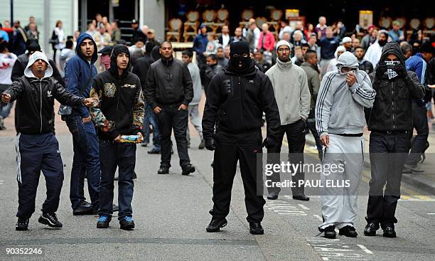 Anti-fascist campaigners gather to demonstrate against members of the English Defence League in Birmingham, central England, on September 5, 2009....