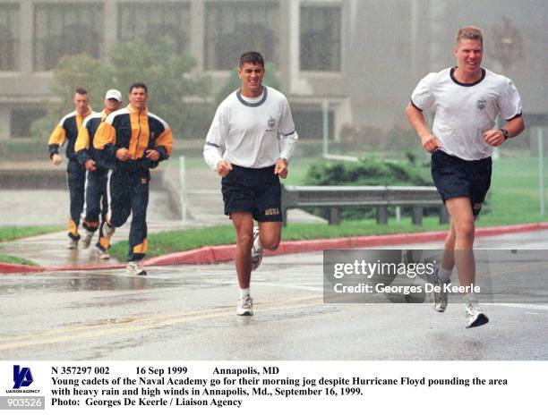 Sep 1999 Annapolis, MD Young cadets of the Naval Academy go for their morning jog despite Hurricane Floyd pounding the area with heavy rain and high...