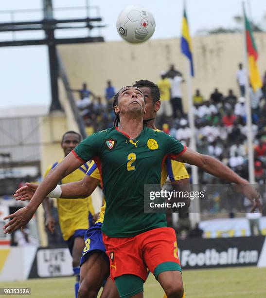 Cameroon's national football team player Benoit Assou Ekotto duels for the ball with Gabon's national football team player on September 5, 2009 in...