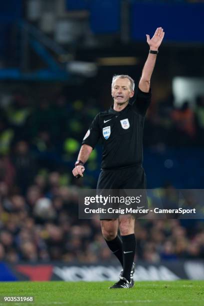 Referee Martin Atkinson during the Carabao Cup Semi-Final First Leg match between Chelsea and Arsenal at Stamford Bridge on January 10, 2018 in...