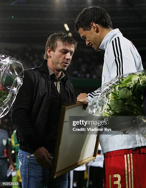 Bernd Schneider and Michael Ballack of Germany are seen ahead of the international friendly match between Germany and South Africa at BayArena on...